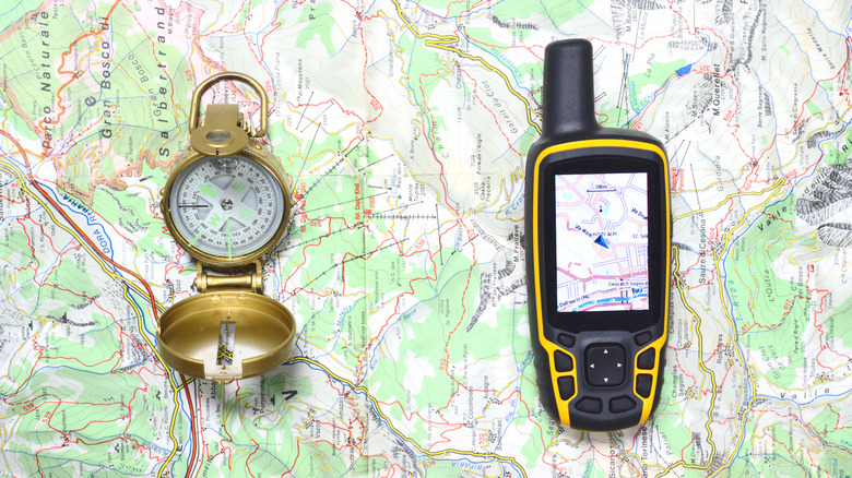 Compass and GPS set out on map