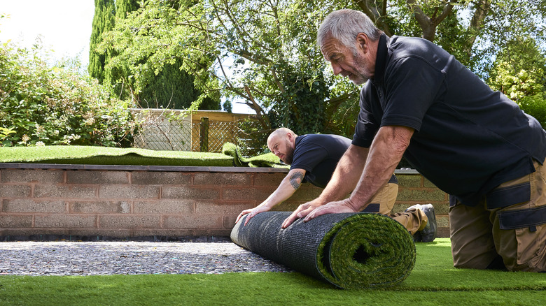 Landscapers rolling out synthetic grass