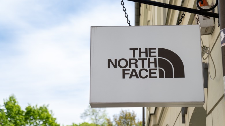 The North Face logo on sign outside shop