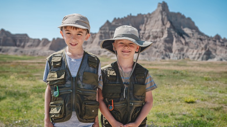 Two brothers with junior ranger gear 
