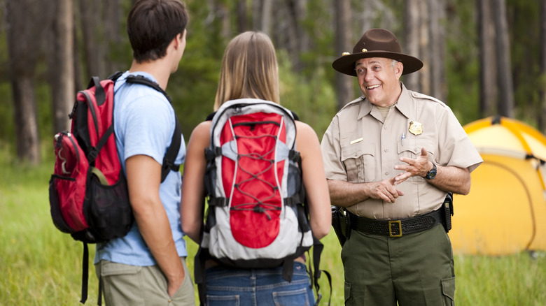 Helpful ranger providing some tips to campers 