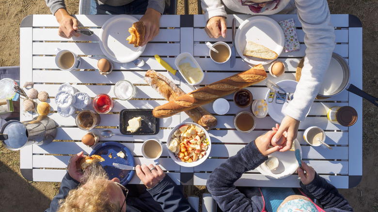 Campers sitting around table at mealtime