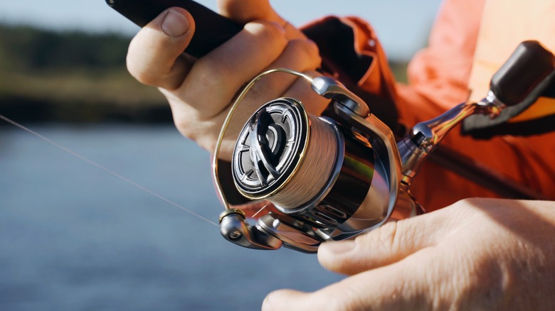 Hands spinning reel, close-up