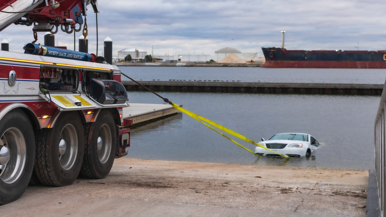 vehicle being pulled from boat ramp