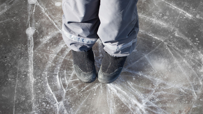 Boots standing on broken ice