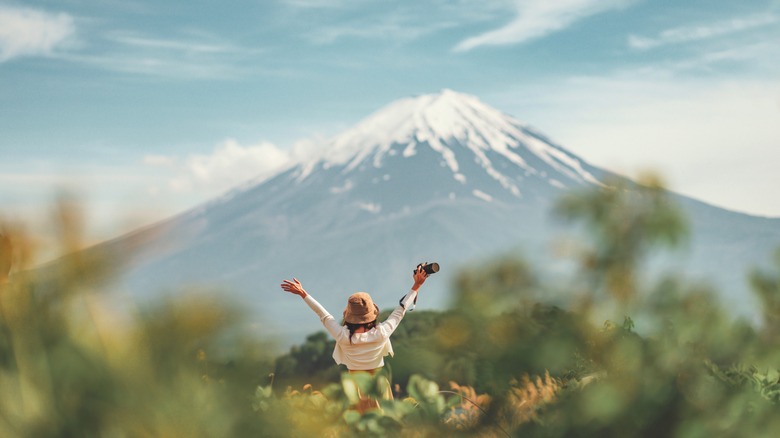 Happy tourist visiting Mount Fuji