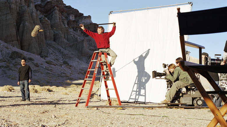 Film crew on set in desert