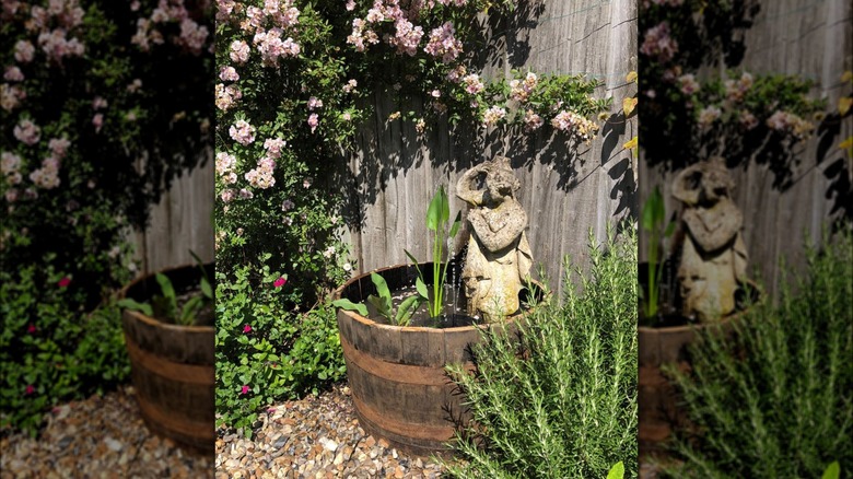 Whiskey barrel as a water fountain yard feature