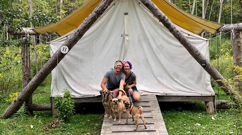 Couple outside tent at Firelight Camps