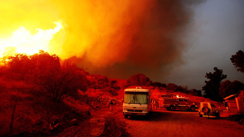 Firefighters and RV near fire