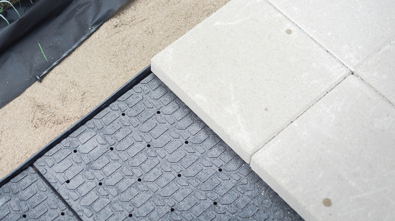 Patio stones on paver panels with concrete edging
