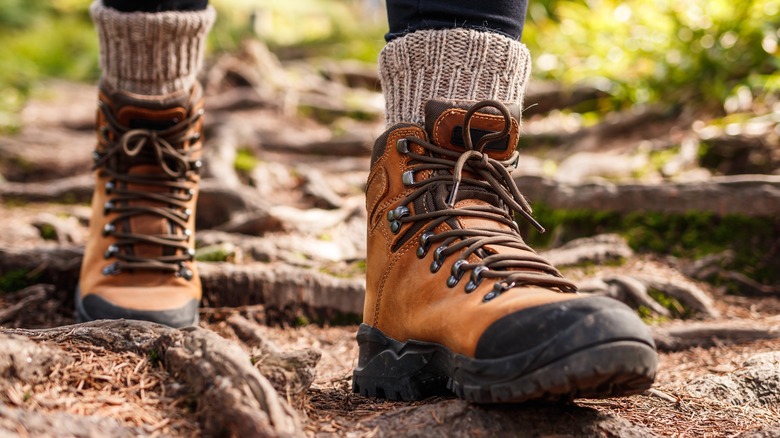 Brown hiking boots on trail