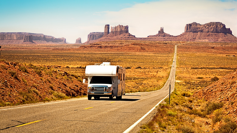 RV on long desert road