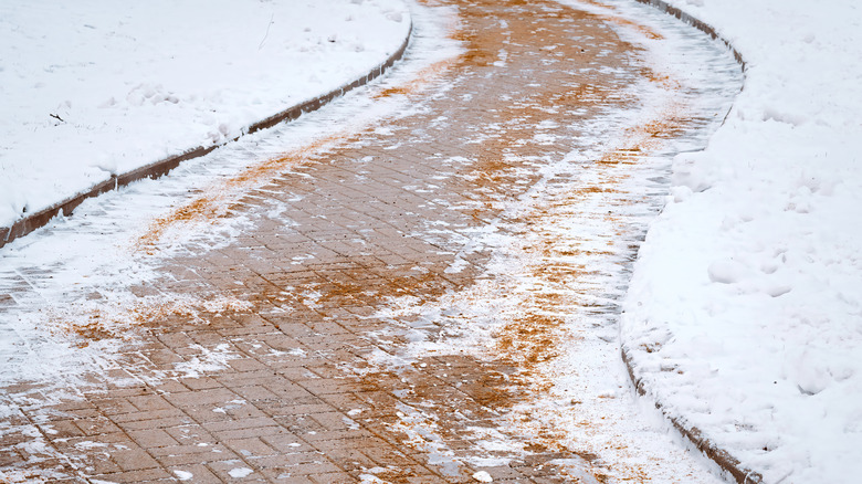 Sidewalk with ice melting