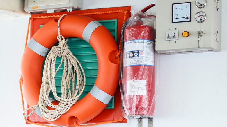 fire extinguisher and life ring on boat