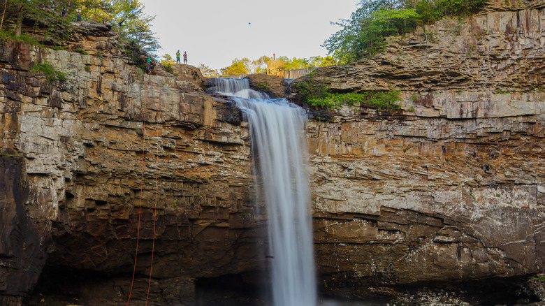 Two hikers standing on top of Desoto Falls