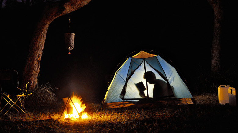 Solo camper in tent