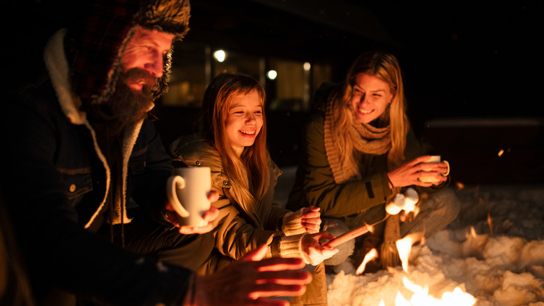 Campers enjoying a winter fire