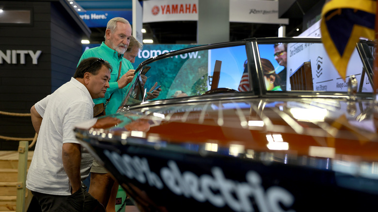 Boat buyer inspecting boat