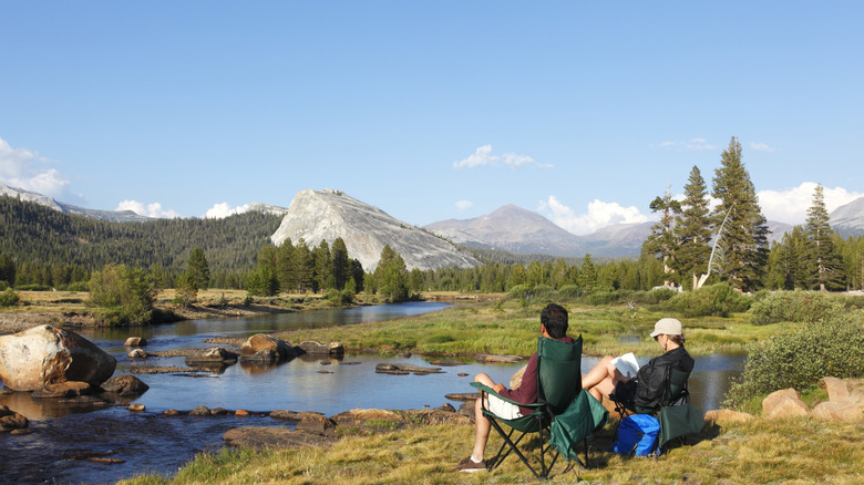 Couple enjoying a picnic by the river in Yosemite NP