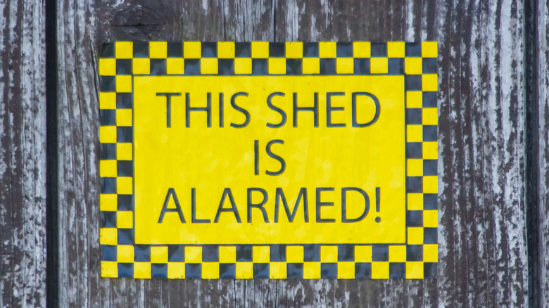 Warning sign reading "THIS SHED IS ALARMED!"