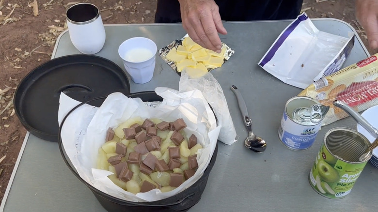 Caramel apple dump cake being prepared on table