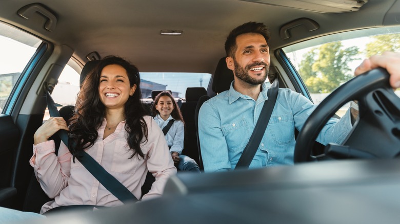 Happy family heading out on the road trip