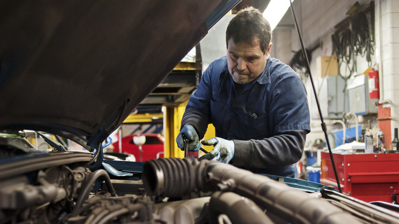 Mechanic servicing a vehicle