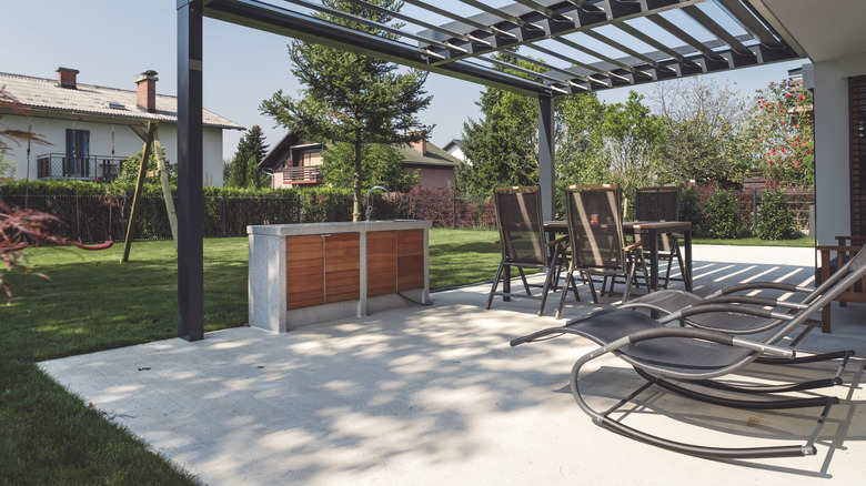 concrete patio with deck chairs and table