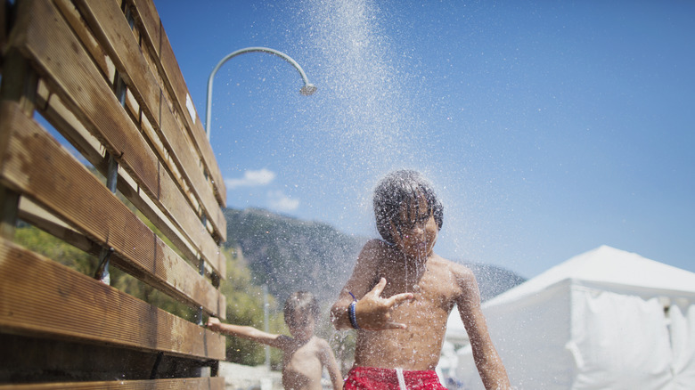 kids shower at beach 