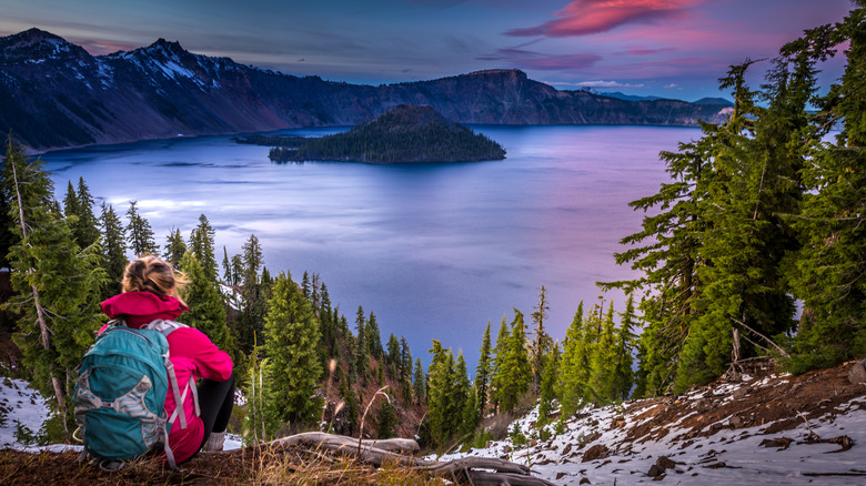 Backpacker looking out at Crater Lake