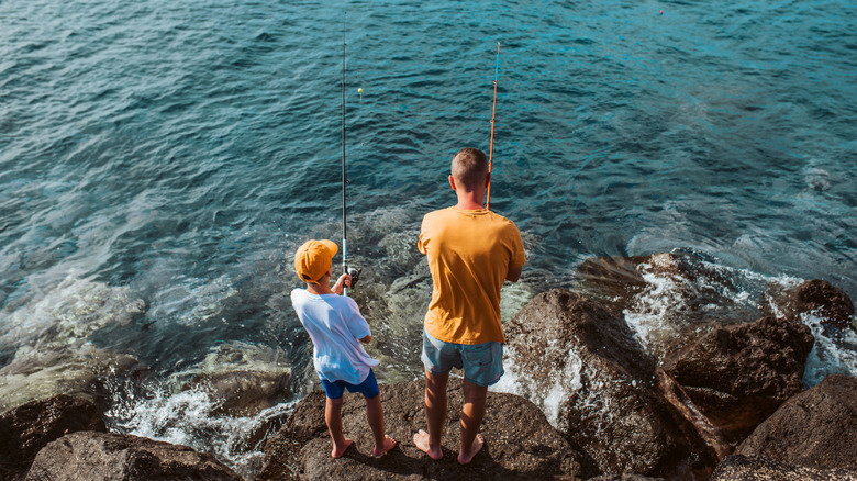 Father and son fishing on jetties