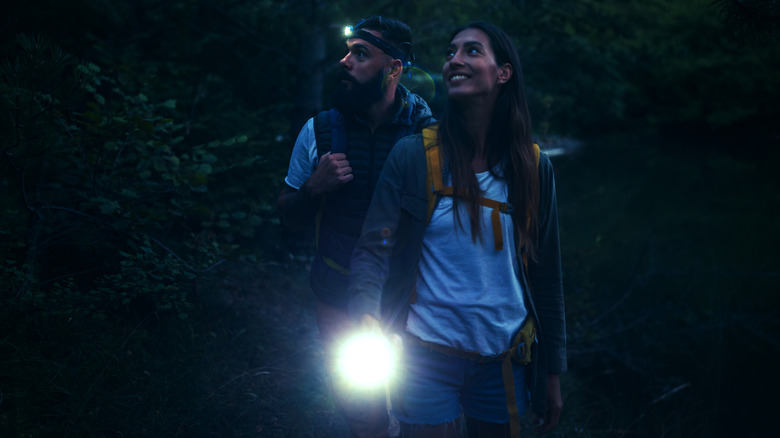 hikers with flashlight