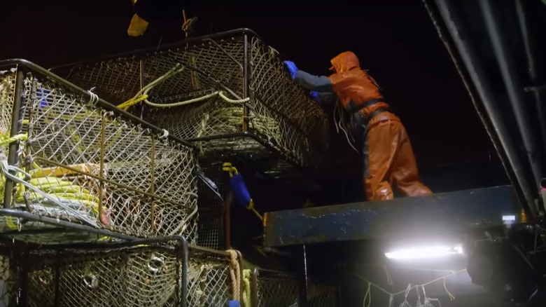 Crabbing crew pulling in crab pots 