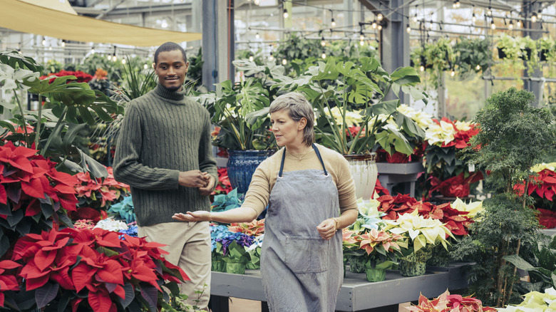 Man and woman in garden center, walking