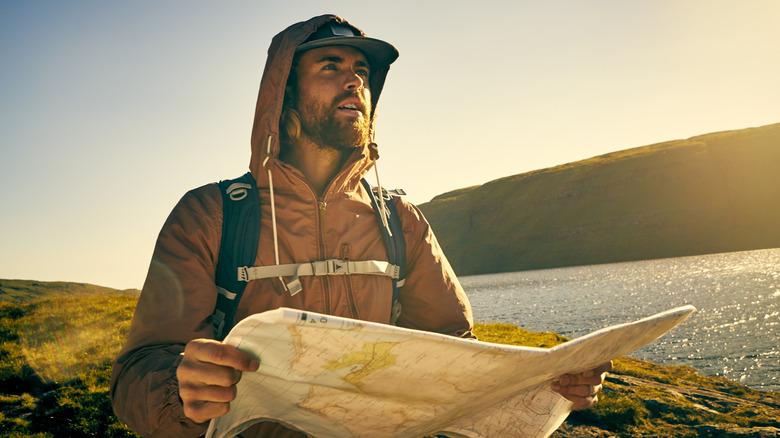 Hiker looking at map