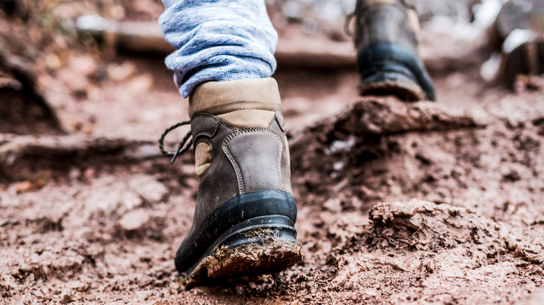 Hiking boots walking in mud