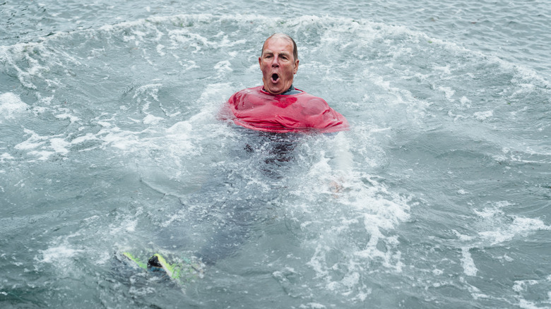 man floating in cold water