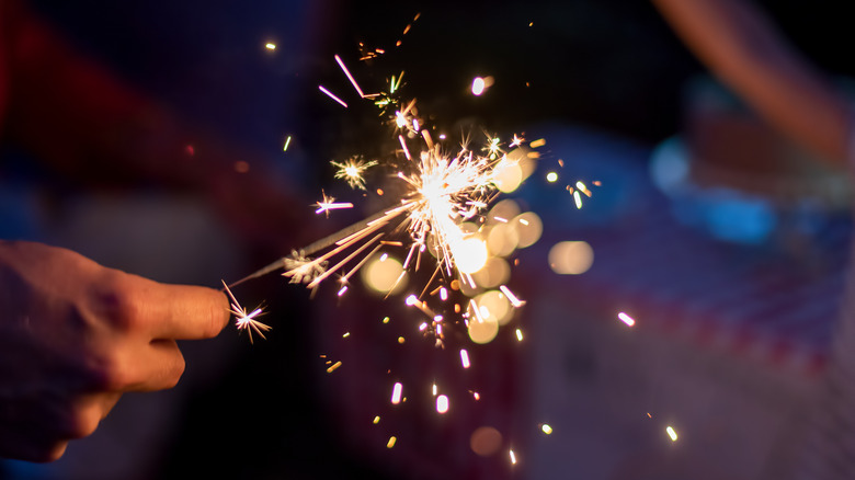 holding sparkler