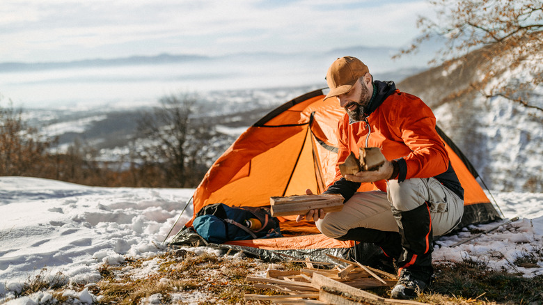 Man camping in winter