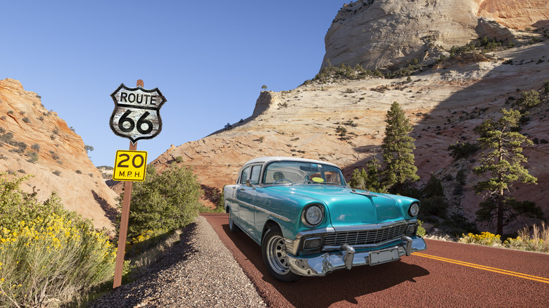 Vintage old car driving Route 66