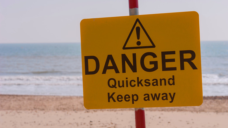 Danger sign warning of quicksand