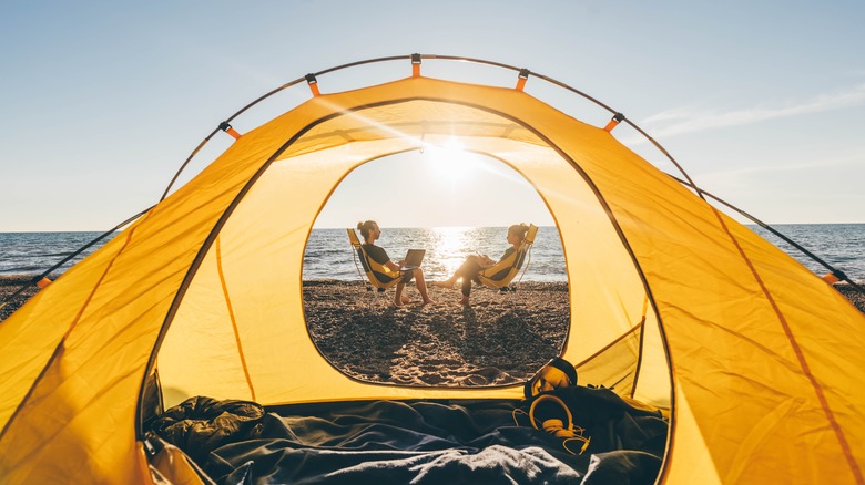 Two people camping on the beach