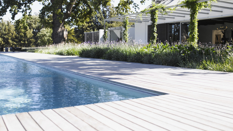 White deck bordering a swimming pool