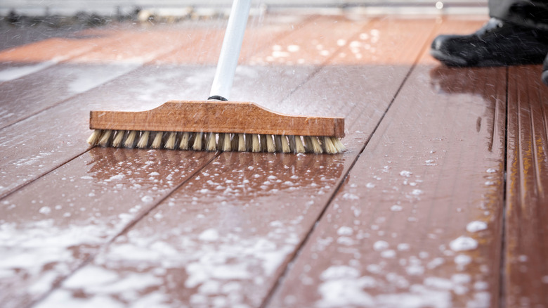 Soft brissled brush used to clean wood deck