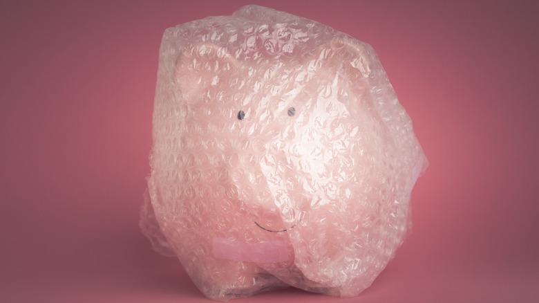 Bubble wrap ball around a toy pig