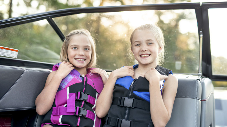 kids on boat with lifejacket