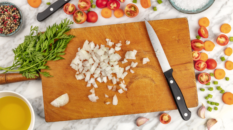 Diced vegetables on a wooden cutting board 