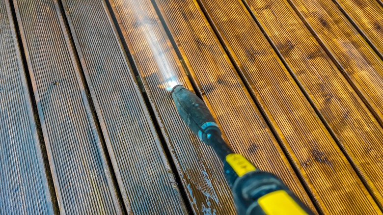 Power washer on hardwood deck