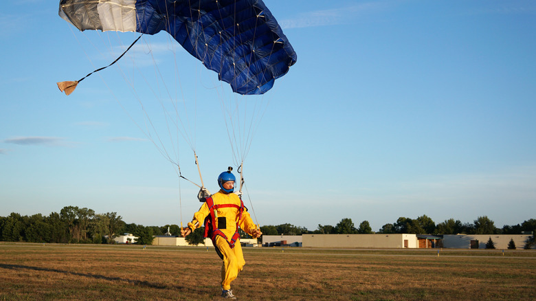 Skydiver landing safely on the ground 